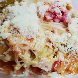 Yep, there are 2 large rolled tacos under there!  Tacos Honrudenos