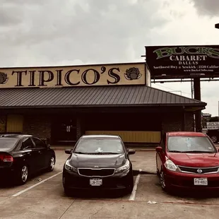 a row of cars parked in a parking lot