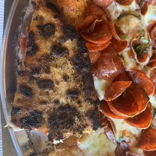 Check out the gorgeous char on this pristine pizza.