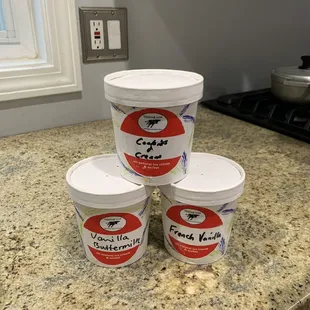 three buckets of ice cream