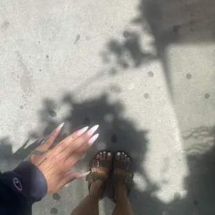 long acrylic nails and painted toes