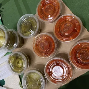 a variety of pickles in plastic containers