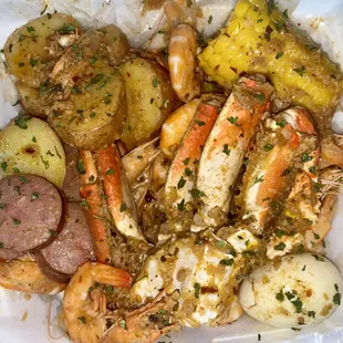 a plate of seafood and potatoes