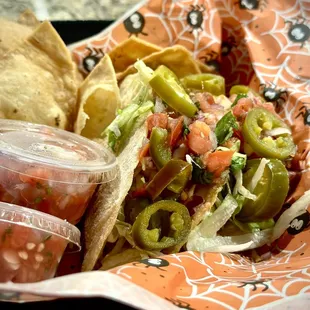 a plate of tacos and chips
