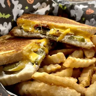 a grilled cheeseburger and french fries