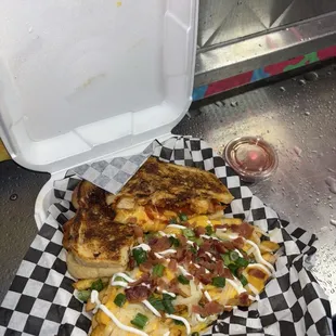 Buffalo chicken sandwich with loaded fries