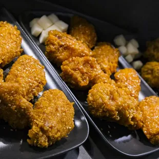 two trays of fried chicken