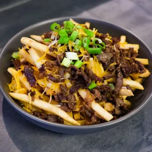 a bowl of chili fries