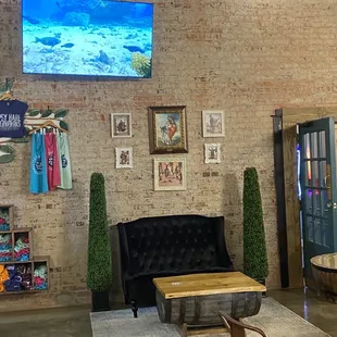 a living room with exposed brick walls