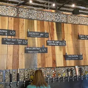 a wall of beer taps
