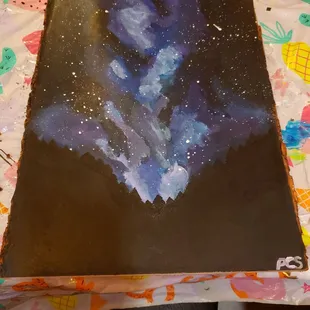 "Galaxy on a wood plank" though mine looks more like mystic smoke than a galaxy. Still not bad though.