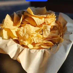 a bowl of chips on a table
