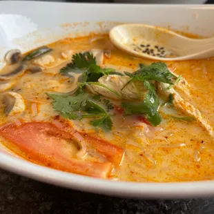 a bowl of soup with a spoon