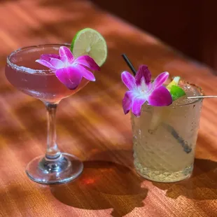 two cocktails on a wooden table