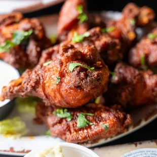 a plate of fried chicken wings