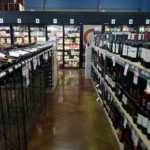 rows of wine bottles in a store