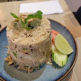 Pineapple fried rice with chicken and pork. Extra fee for two proteins.