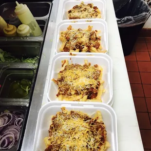 a row of trays of food