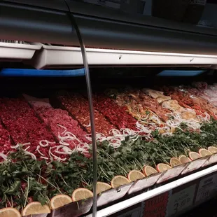 a display of meat and vegetables