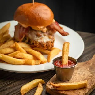 a chicken sandwich with fries and ketchup