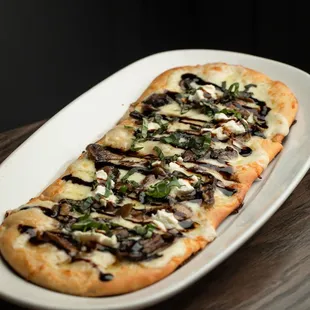 a flatbread pizza on a plate