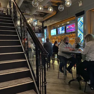 Bar area, stairs lead to upstairs seating