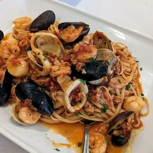 I've had the linguini pescatore before, clams, mussels, calamari, shrimp, and scallops in a slightly sweet tomato sauce. So so so good.