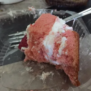 1/2 eaten slice of strawberry shortcake