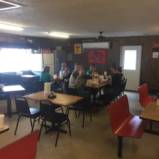 a group of people sitting at tables
