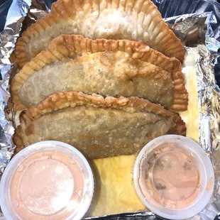 Pastelillos (Puerto Rican meat pie) w/a garlic dipping sauce