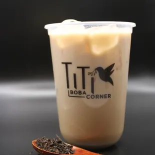 a cup of coffee and a spoon