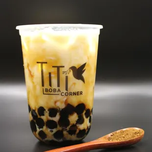 a cup of boba and a spoon
