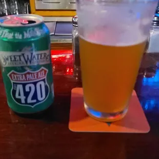 a glass of beer and a can