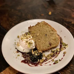 Rosemary and orange olive oil cake, luxardo cherries, honey whipped cream, pistachio ($9)