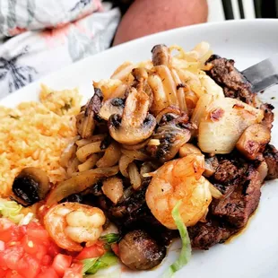 Rib eye steak with shrimp and grilled onions