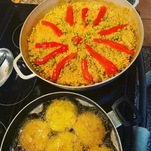 two pans of food on a stove