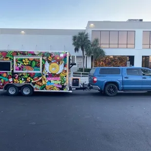 a truck with a food cart on the back