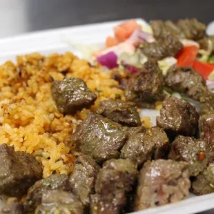 a plate of meat and rice