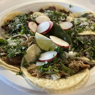 6 tacos clockwise from bottom  carnitas, al pastor, cabeza