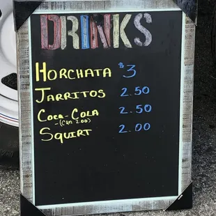 a chalkboard sign for drinks