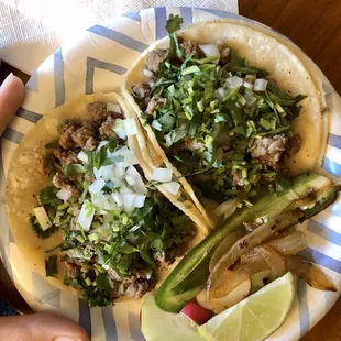 The teenyest tinyest tacos from Tito's. $2.50 a piece. (hand pictured for scale)