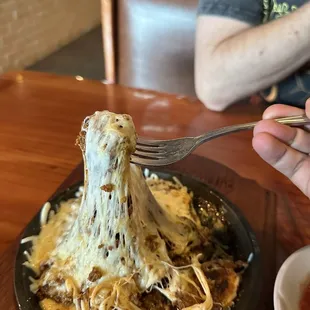 Queso Fundido: Waste of money. You cannot dip chips into it. It had to be eaten with a fork and knife.