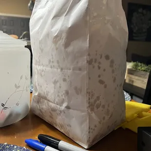a paper bag with a face drawn on it