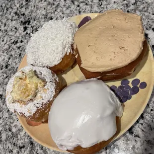Coconut cream, key lime pie, raspberry filled and cinnamon maple frosted donuts