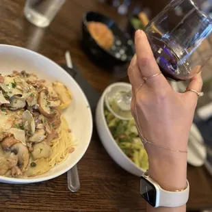 a person holding a glass of wine