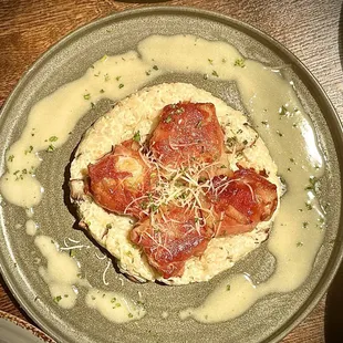 Prosciutto wrapped scallops on a bed of mushroom &amp; truffle oil risotto
