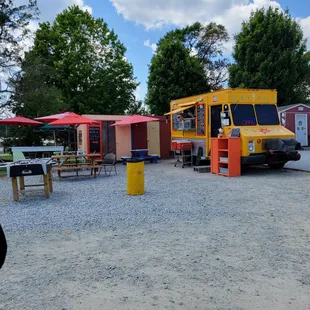 Food truck in parking lot of Bargain Barn