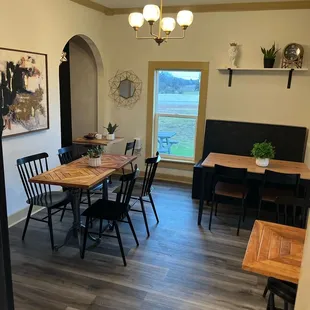 a dining room with a table and chairs