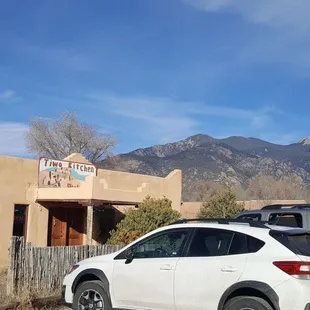 two cars parked in front of a building