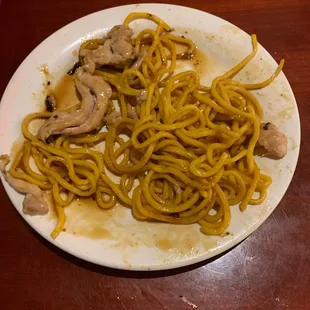 a plate of noodles and mushrooms